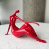 Bold Red Reclining Woman Figurine