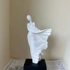 Whispering Grace: Flowing Figure Statue