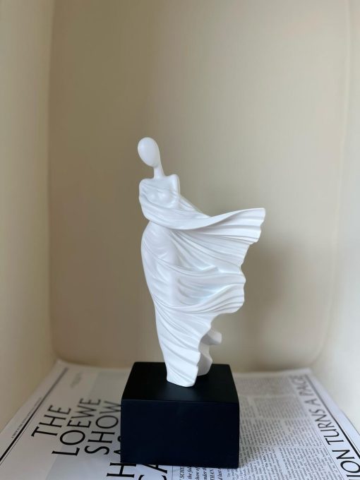 Whispering Grace: Flowing Figure Statue