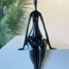 Noir Poise: Seated Abstract Figure